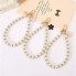 Брелок no brand Pearl Necklace черный цветок, жемчужные бусины, стильный аксессуар